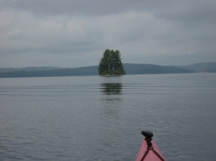 Island in North Arm with a window in the trees.